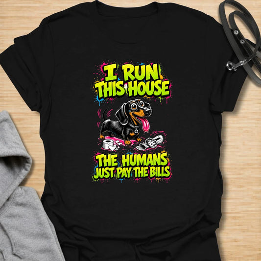 Run This House t-shirt for dachshund lovers who know the smallest dog in the home is usually the one in charge. This bold comic-style design features a mischievous doxie and the phrase “I Run This House The Humans Just Pay The Bills.” Perfect for sausage dog owners, doxie moms, and anyone whose dog rules the household.