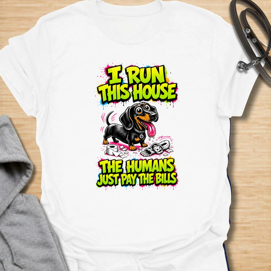 Run This House t-shirt for dachshund lovers who know the smallest dog in the home is usually the one in charge. This bold comic-style design features a mischievous doxie and the phrase “I Run This House The Humans Just Pay The Bills.” Perfect for sausage dog owners, doxie moms, and anyone whose dog rules the household.