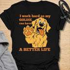 This I Work Hard So My Goldie Can Have A Better Life t-shirt is made for Golden Retriever owners who know exactly where their money, time, and attention really go. Featuring a happy cartoon Goldie with a big smile, raised paw, and playful bold lettering, this design has a funny, lovable dog-parent feel. Perfect for Golden Retriever moms, Golden Retriever dads, Goldie lovers, rescue dog owners, and anyone who proudly spoils their golden best friend. Black