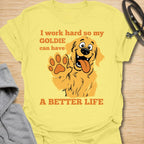 This I Work Hard So My Goldie Can Have A Better Life t-shirt is made for Golden Retriever owners who know exactly where their money, time, and attention really go. Featuring a happy cartoon Goldie with a big smile, raised paw, and playful bold lettering, this design has a funny, lovable dog-parent feel. Perfect for Golden Retriever moms, Golden Retriever dads, Goldie lovers, rescue dog owners, and anyone who proudly spoils their golden best friend. Cornsilk