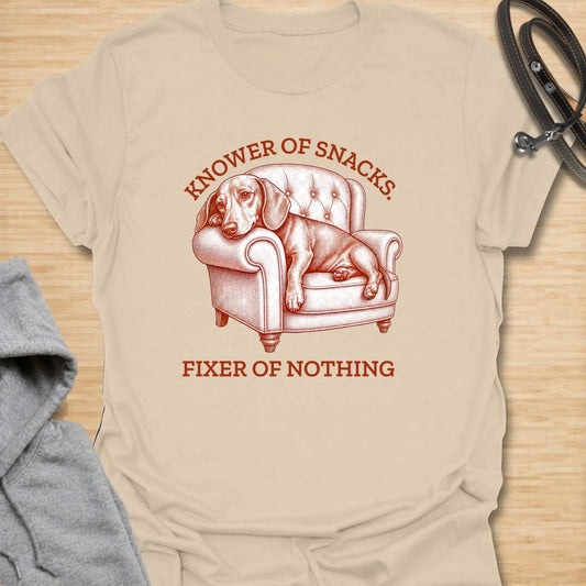 This knower of snacks t-shirt is a funny dachshund design for anyone whose dog is excellent at demanding food and fixing nothing. The vintage-style dachshund lounging in a chair gives the artwork a dramatic, slightly useless expert energy. It is perfect for dachshund moms, doxie dads, and dog lovers who know snack knowledge is a serious skill. A great gift for anyone with a dachshund who supervises everything but contributes very little.