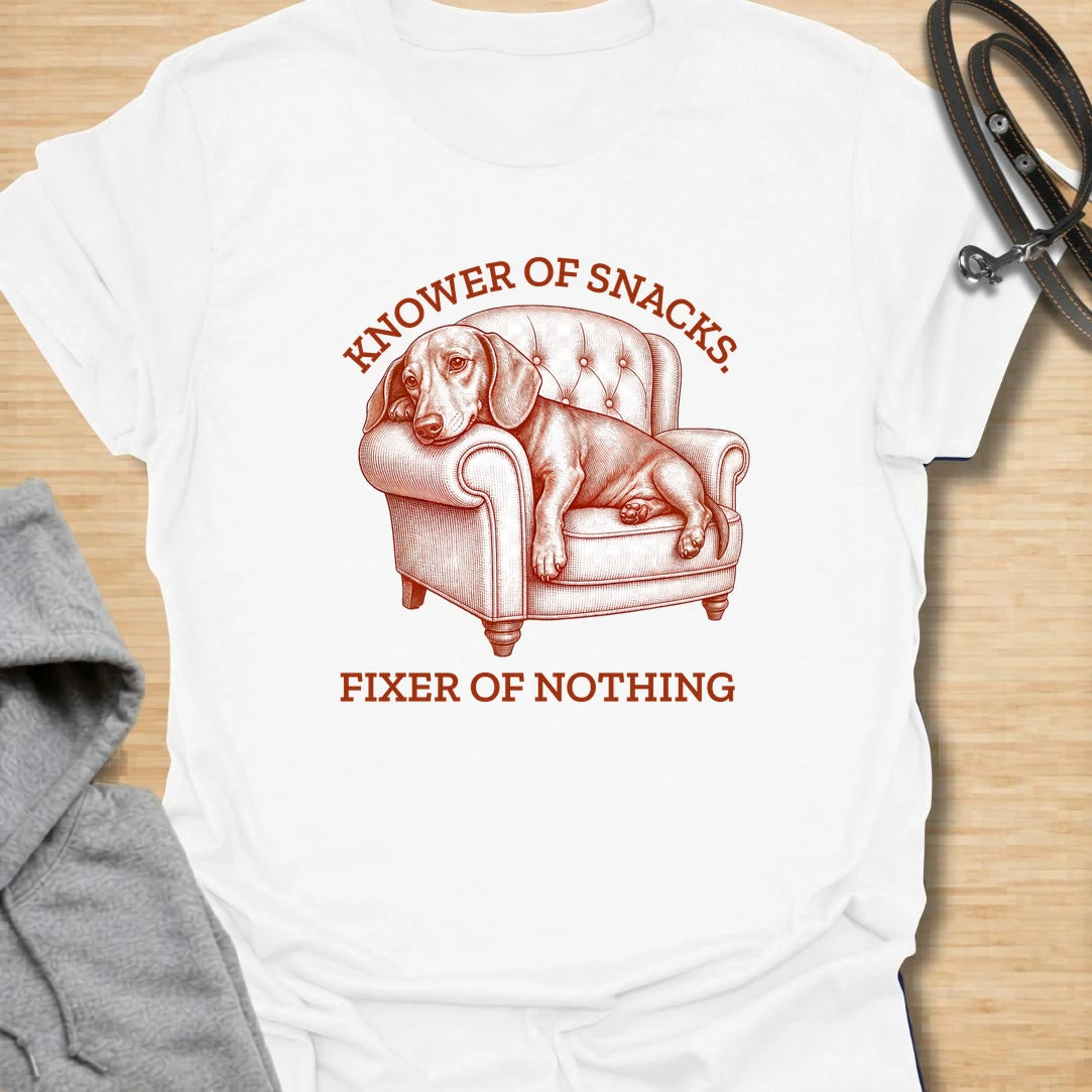 This knower of snacks t-shirt is a funny dachshund design for anyone whose dog is excellent at demanding food and fixing nothing. The vintage-style dachshund lounging in a chair gives the artwork a dramatic, slightly useless expert energy. It is perfect for dachshund moms, doxie dads, and dog lovers who know snack knowledge is a serious skill. A great gift for anyone with a dachshund who supervises everything but contributes very little.