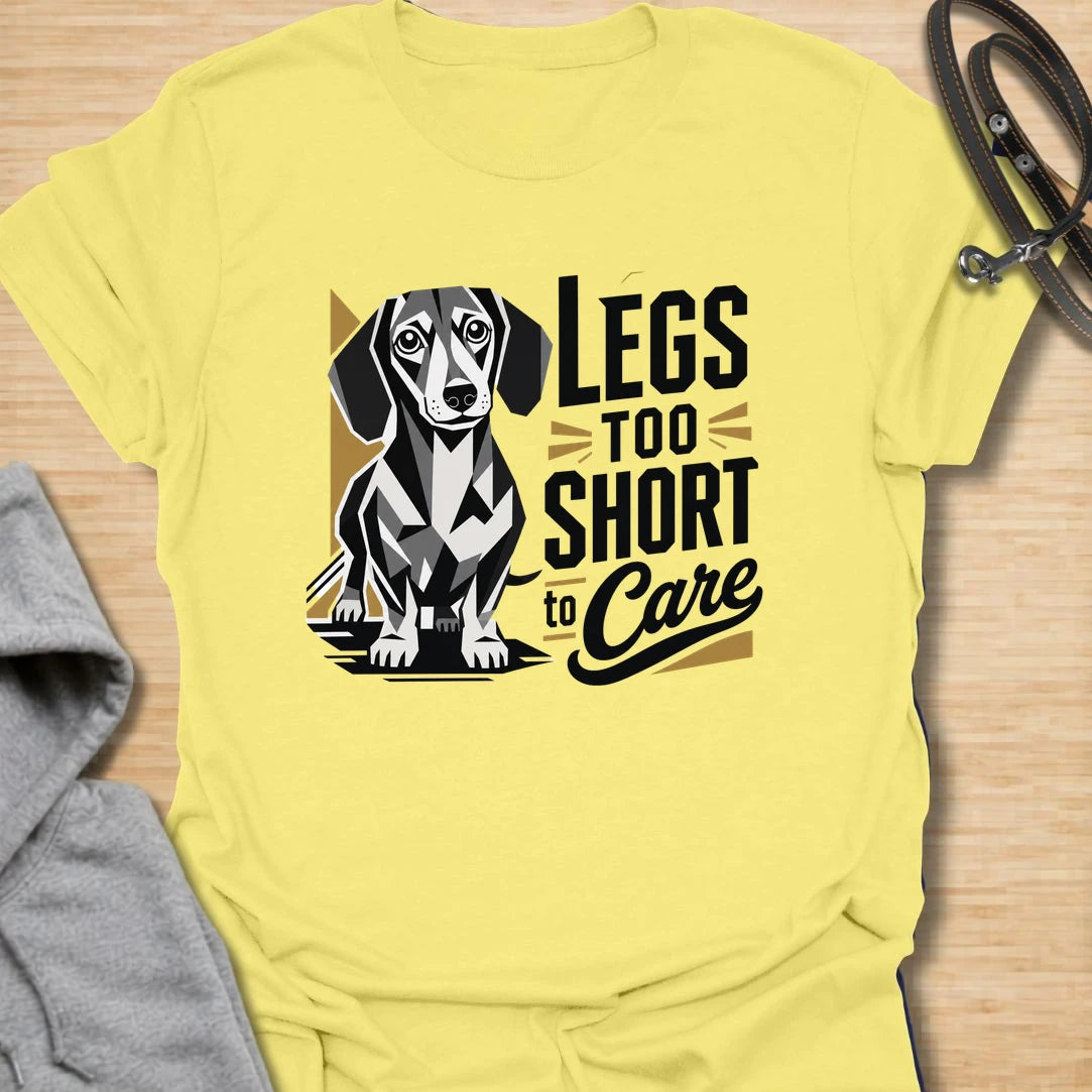 Legs Too Short To Care dachshund t-shirt for the wiener dog with zero worries and maximum charm. This funny design celebrates the classic dachshund build with bold lettering and a cute doxie illustration. It is a great choice for dachshund moms, doxie dads, and small dog lovers. Perfect for anyone who knows confidence has nothing to do with leg length.