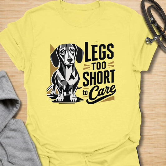 Legs Too Short To Care dachshund t-shirt for the wiener dog with zero worries and maximum charm. This funny design celebrates the classic dachshund build with bold lettering and a cute doxie illustration. It is a great choice for dachshund moms, doxie dads, and small dog lovers. Perfect for anyone who knows confidence has nothing to do with leg length.