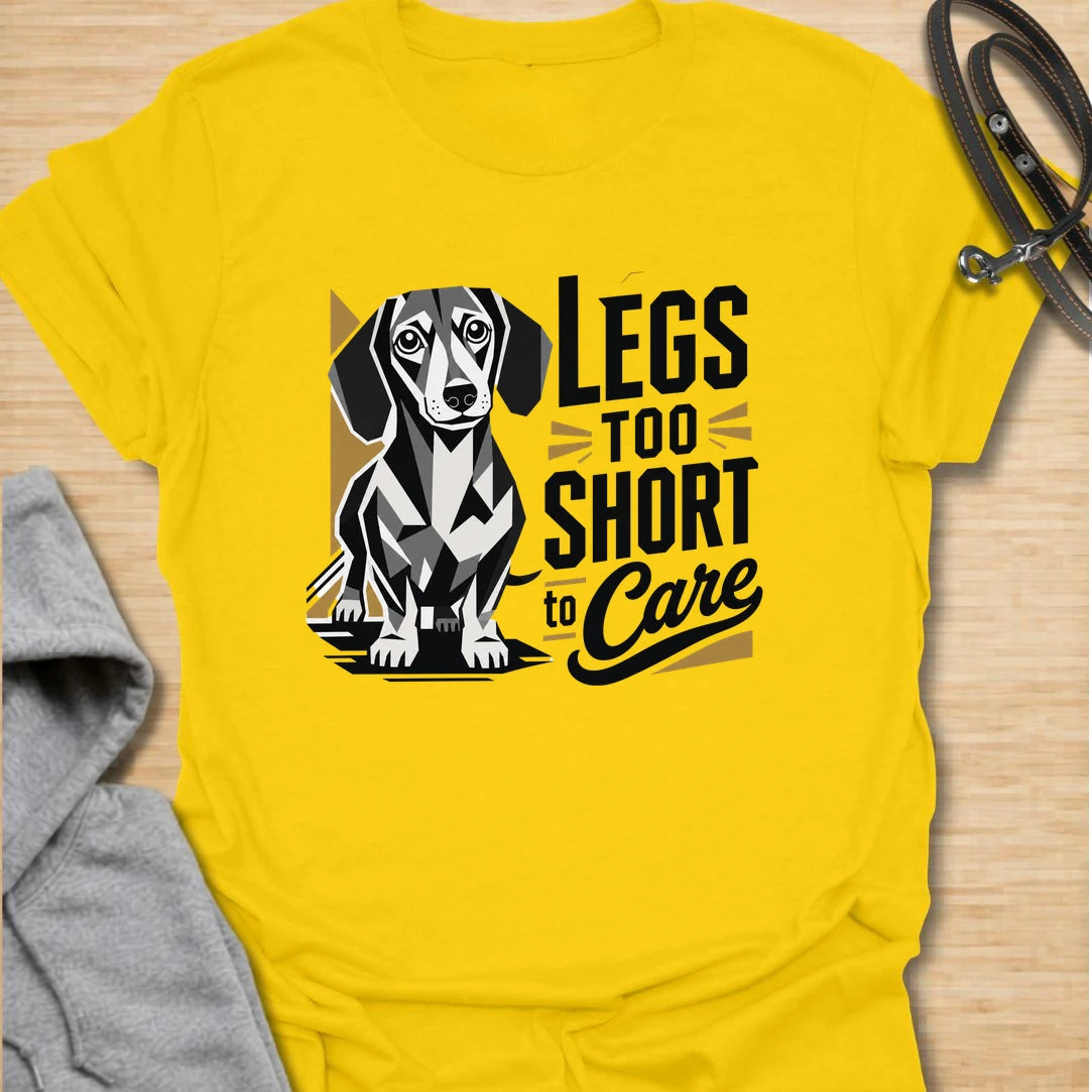 Legs Too Short To Care dachshund t-shirt for the wiener dog with zero worries and maximum charm. This funny design celebrates the classic dachshund build with bold lettering and a cute doxie illustration. It is a great choice for dachshund moms, doxie dads, and small dog lovers. Perfect for anyone who knows confidence has nothing to do with leg length.
