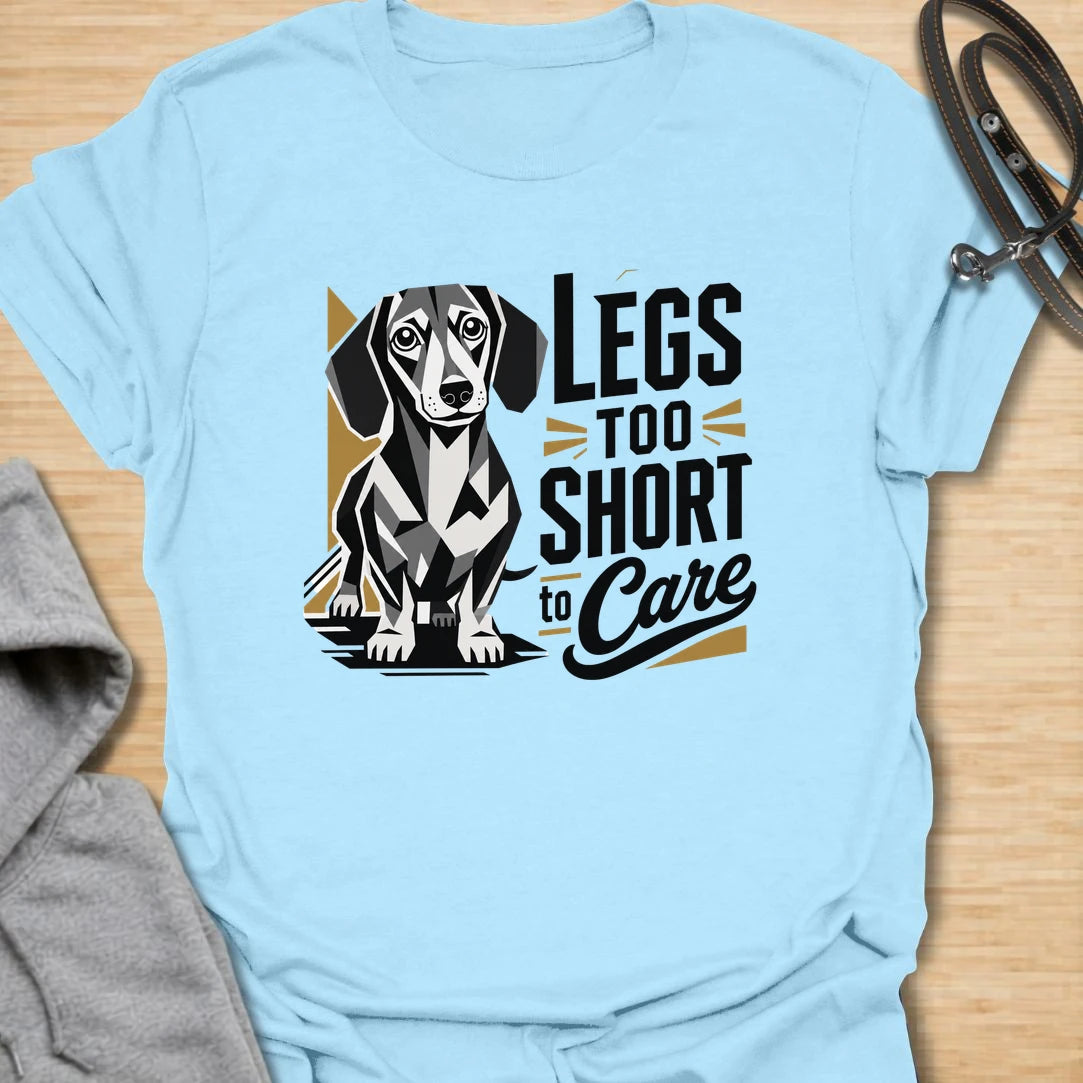 Legs Too Short To Care dachshund t-shirt for the wiener dog with zero worries and maximum charm. This funny design celebrates the classic dachshund build with bold lettering and a cute doxie illustration. It is a great choice for dachshund moms, doxie dads, and small dog lovers. Perfect for anyone who knows confidence has nothing to do with leg length.