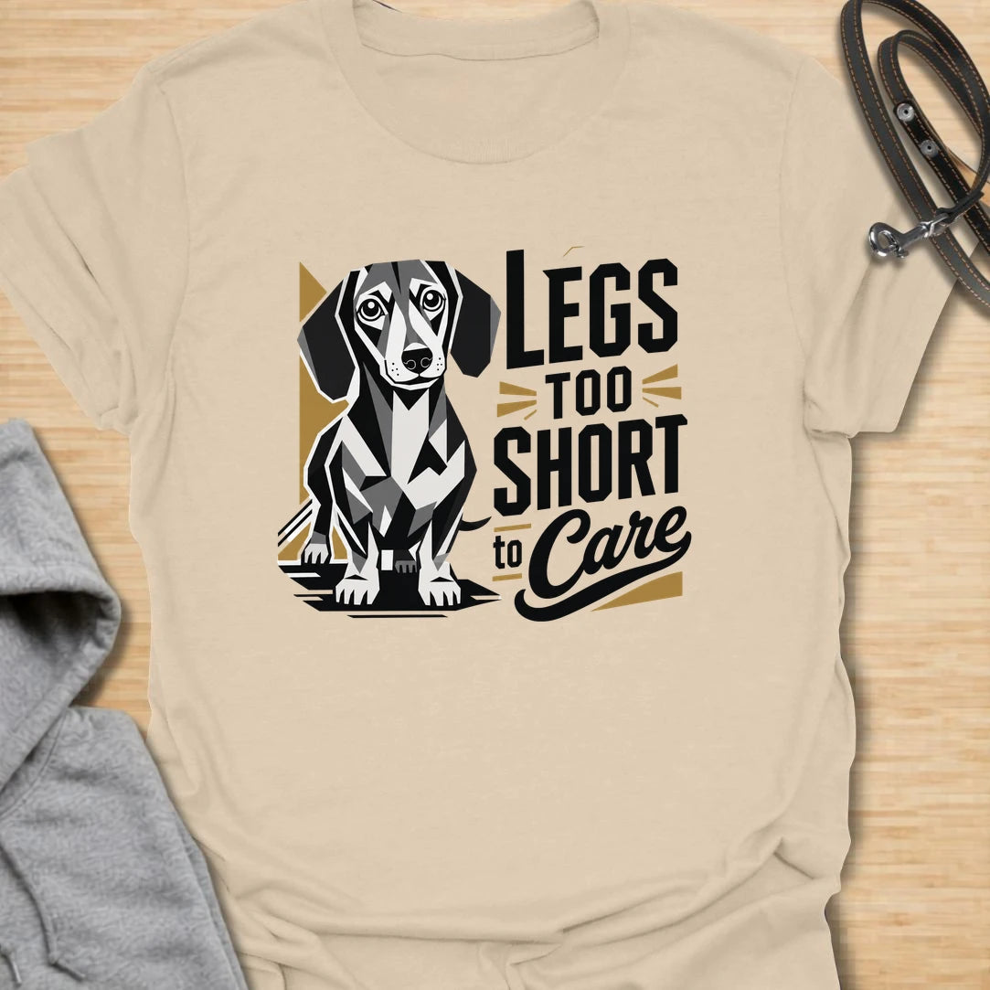 Legs Too Short To Care dachshund t-shirt for the wiener dog with zero worries and maximum charm. This funny design celebrates the classic dachshund build with bold lettering and a cute doxie illustration. It is a great choice for dachshund moms, doxie dads, and small dog lovers. Perfect for anyone who knows confidence has nothing to do with leg length.
