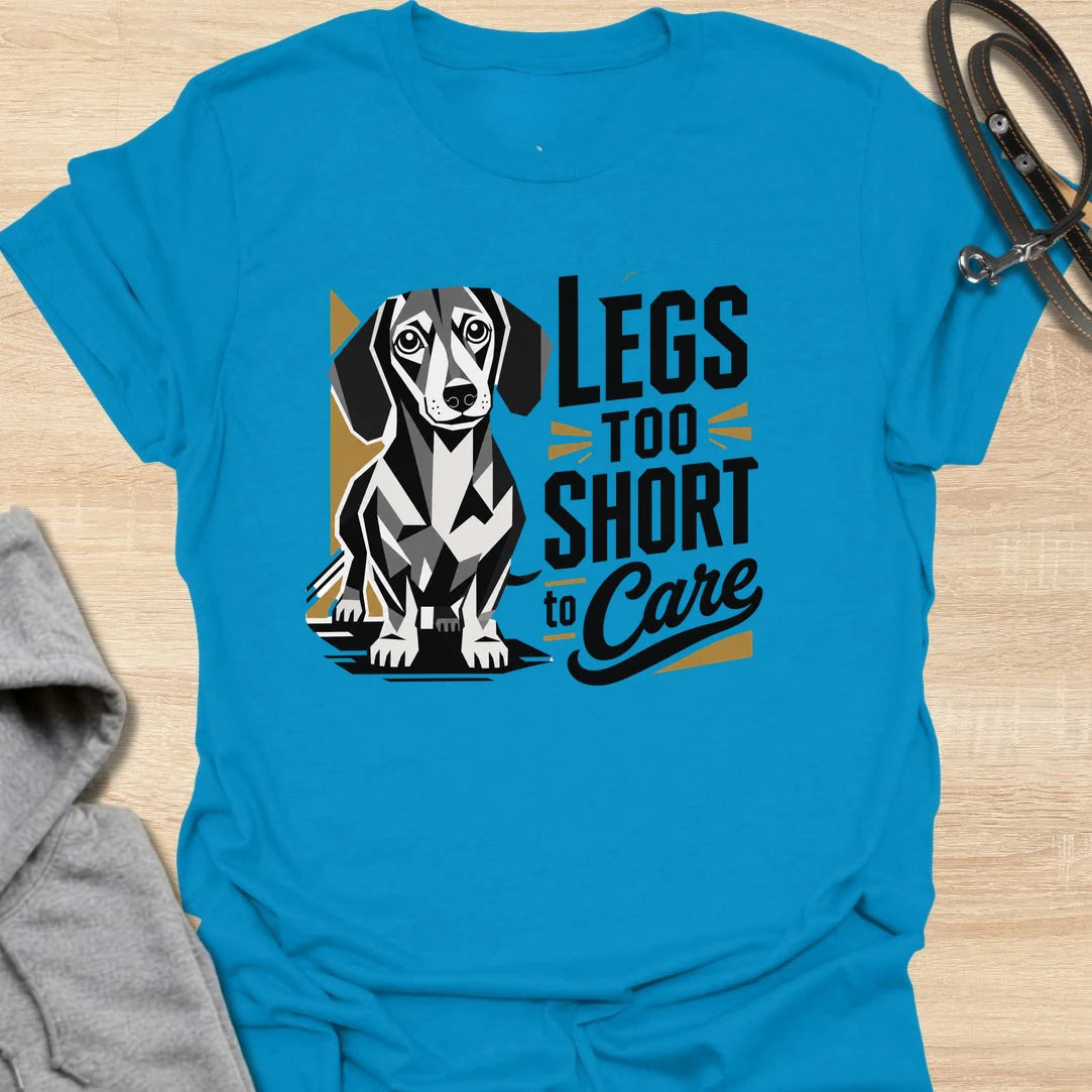 Legs Too Short To Care dachshund t-shirt for the wiener dog with zero worries and maximum charm. This funny design celebrates the classic dachshund build with bold lettering and a cute doxie illustration. It is a great choice for dachshund moms, doxie dads, and small dog lovers. Perfect for anyone who knows confidence has nothing to do with leg length.