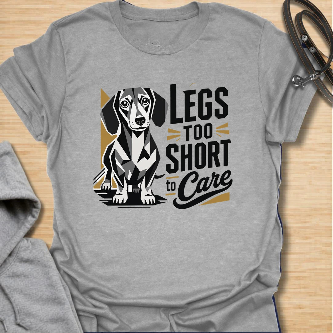 Legs Too Short To Care dachshund t-shirt for the wiener dog with zero worries and maximum charm. This funny design celebrates the classic dachshund build with bold lettering and a cute doxie illustration. It is a great choice for dachshund moms, doxie dads, and small dog lovers. Perfect for anyone who knows confidence has nothing to do with leg length.