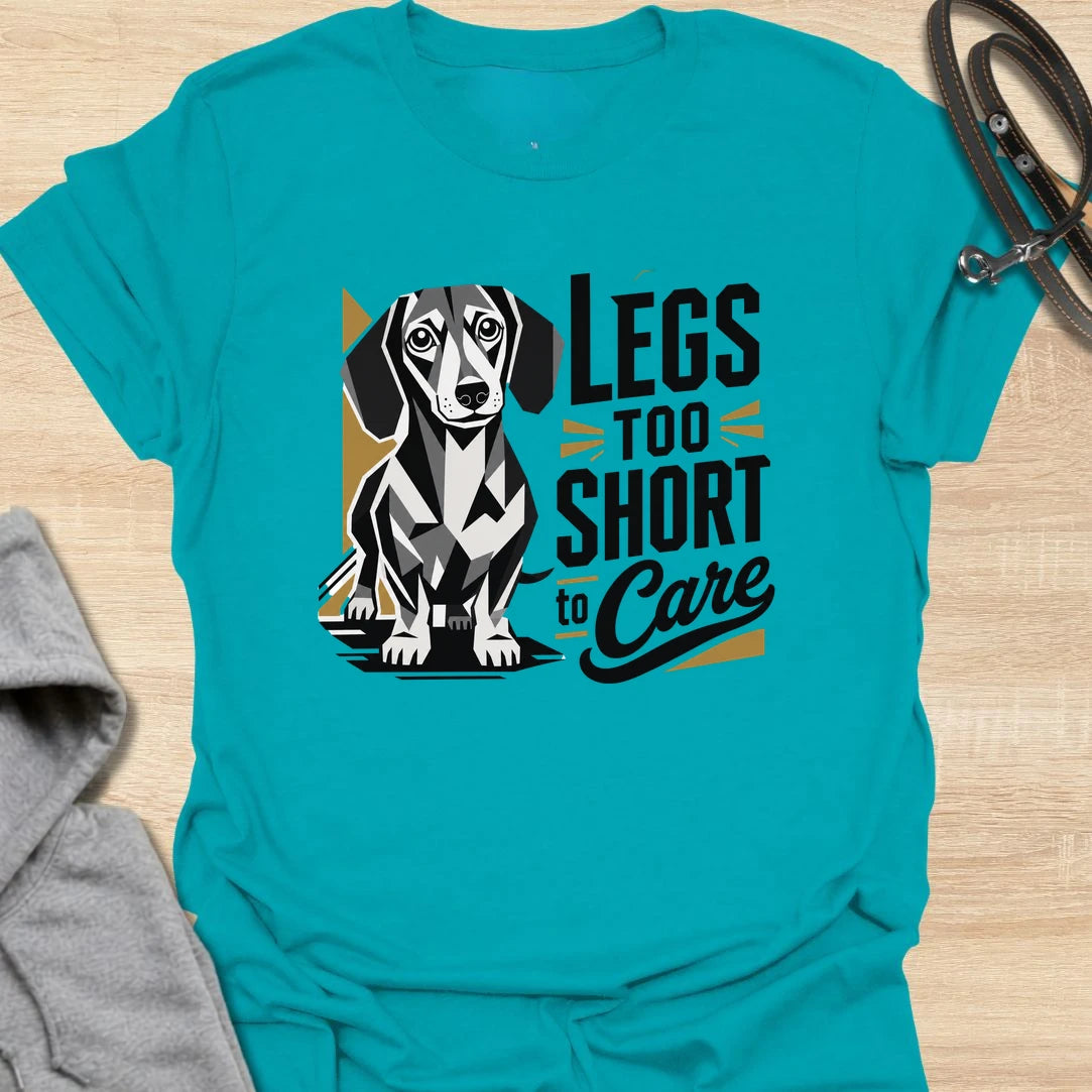 Legs Too Short To Care dachshund t-shirt for the wiener dog with zero worries and maximum charm. This funny design celebrates the classic dachshund build with bold lettering and a cute doxie illustration. It is a great choice for dachshund moms, doxie dads, and small dog lovers. Perfect for anyone who knows confidence has nothing to do with leg length.