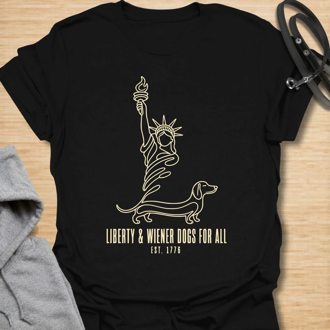This Liberty And Wiener Dogs For All t-shirt is made for dachshund lovers who want a fun patriotic dog design with a clever wiener dog twist. Featuring a simple line-art Statue of Liberty inspired dachshund design with the phrase Est. 1776, this breed-specific tee is great for dachshund moms, dachshund dads, wiener dog fans, patriotic dog lovers, Fourth of July outfits, and anyone who believes freedom is better with a little long dog.
