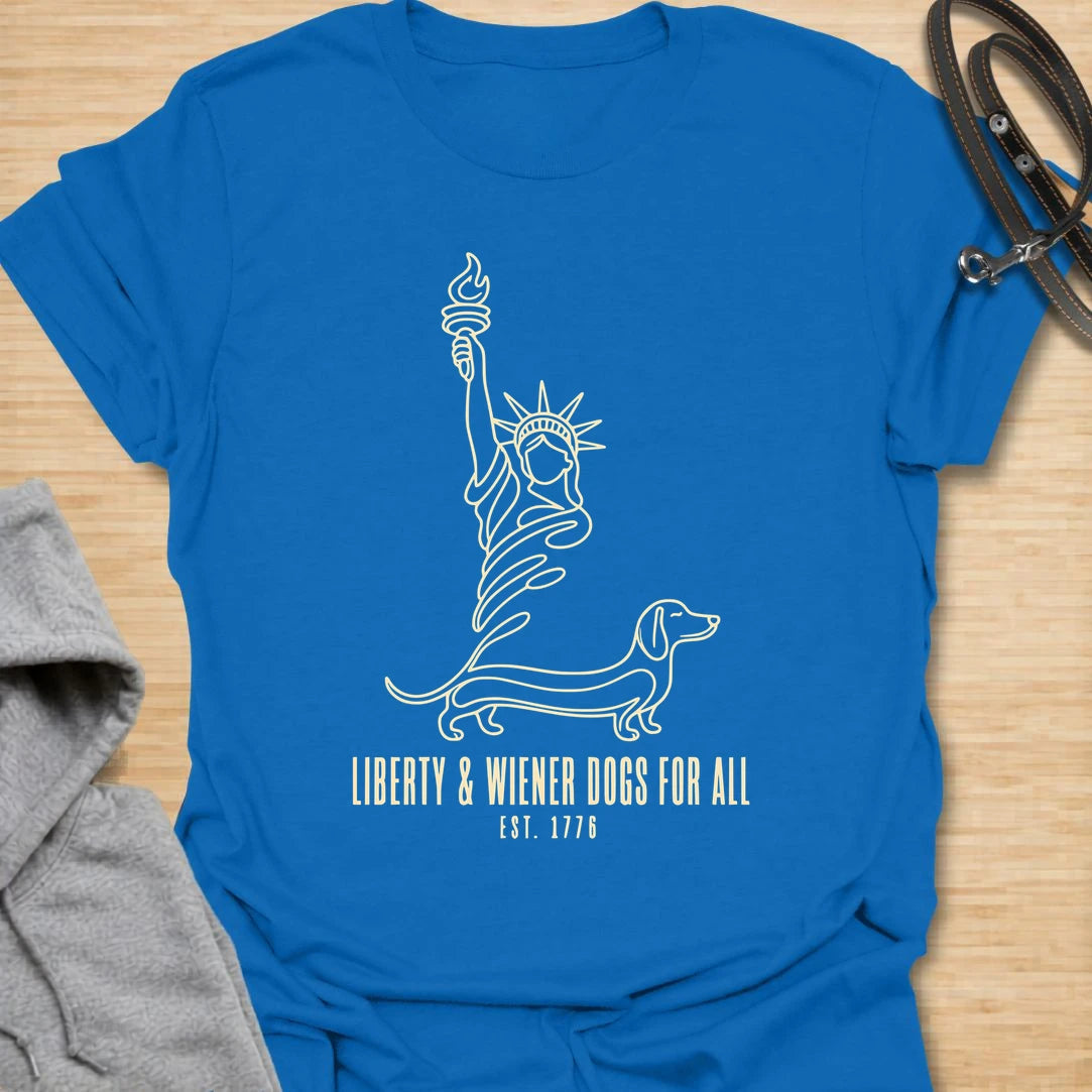 This Liberty And Wiener Dogs For All t-shirt is made for dachshund lovers who want a fun patriotic dog design with a clever wiener dog twist. Featuring a simple line-art Statue of Liberty inspired dachshund design with the phrase Est. 1776, this breed-specific tee is great for dachshund moms, dachshund dads, wiener dog fans, patriotic dog lovers, Fourth of July outfits, and anyone who believes freedom is better with a little long dog.