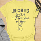 This Life Is Better With A Frenchie Or Two t-shirt is made for French Bulldog lovers who know one Frenchie is wonderful, but two is even better. Featuring a simple Frenchie illustration with clean mixed typography, this design has a sweet, easy-to-wear dog-parent feel for everyday style. Perfect for Frenchie moms, Frenchie dads, French Bulldog owners, rescue dog lovers, and anyone whose life is happier with a little Frenchie chaos.