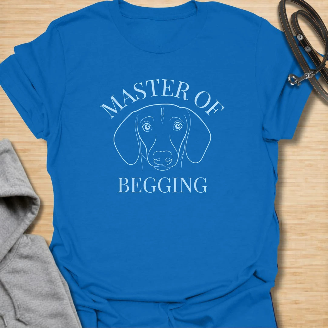 Master Of Begging t-shirt for dachshund owners who know those big doxie eyes are impossible to resist. This simple line-art dachshund design is perfect for sausage dog lovers, dog moms, and anyone whose pup has perfected the art of asking for treats. A funny gift for pet parents who live with a professional snack negotiator.