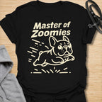 This Master Of Zoomies t-shirt is made for French Bulldog lovers who know their little dog can go from sleepy potato to full-speed chaos in seconds. Featuring a simple line-art Frenchie racing across the design with playful motion marks and bold text, this tee has a funny, energetic breed-specific feel. Perfect for Frenchie moms, Frenchie dads, French Bulldog owners, rescue dog lovers, and anyone whose small dog has sudden bursts of unstoppable zoomie energy.