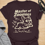 This Master Of Zoomies t-shirt is made for French Bulldog lovers who know their little dog can go from sleepy potato to full-speed chaos in seconds. Featuring a simple line-art Frenchie racing across the design with playful motion marks and bold text, this tee has a funny, energetic breed-specific feel. Perfect for Frenchie moms, Frenchie dads, French Bulldog owners, rescue dog lovers, and anyone whose small dog has sudden bursts of unstoppable zoomie energy.
