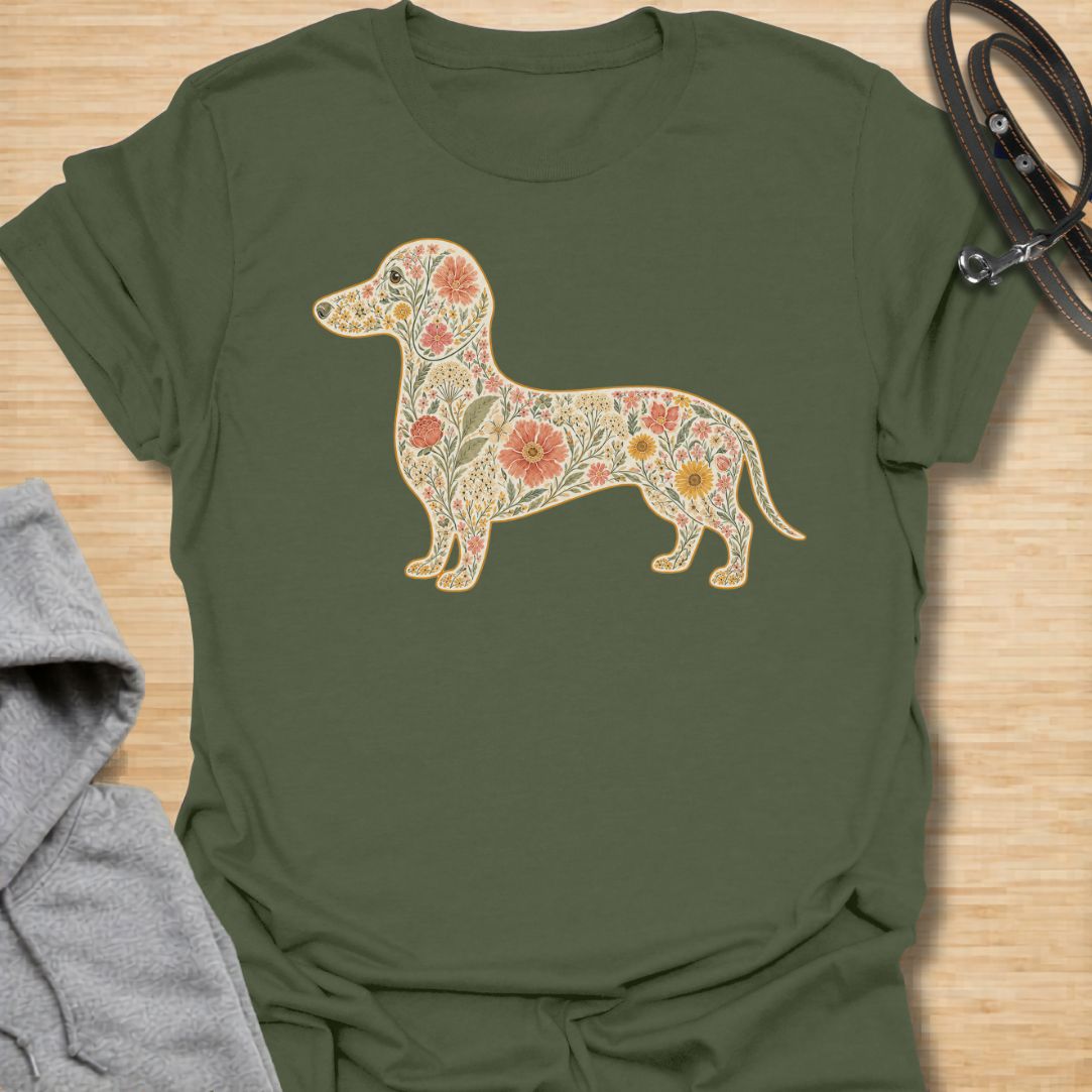 This Floral Dachshund t-shirt is made for doxie lovers who want a beautiful, botanical take on their favorite long dog. Featuring a dachshund silhouette filled with intricate flowers, leaves, vines, and vintage-style floral details, this design blends dog-lover charm with soft garden-inspired artwork. Perfect for dachshund moms, dachshund dads, wiener dog lovers, sausage dog fans, botanical art lovers, and anyone who loves both dogs and flowers.