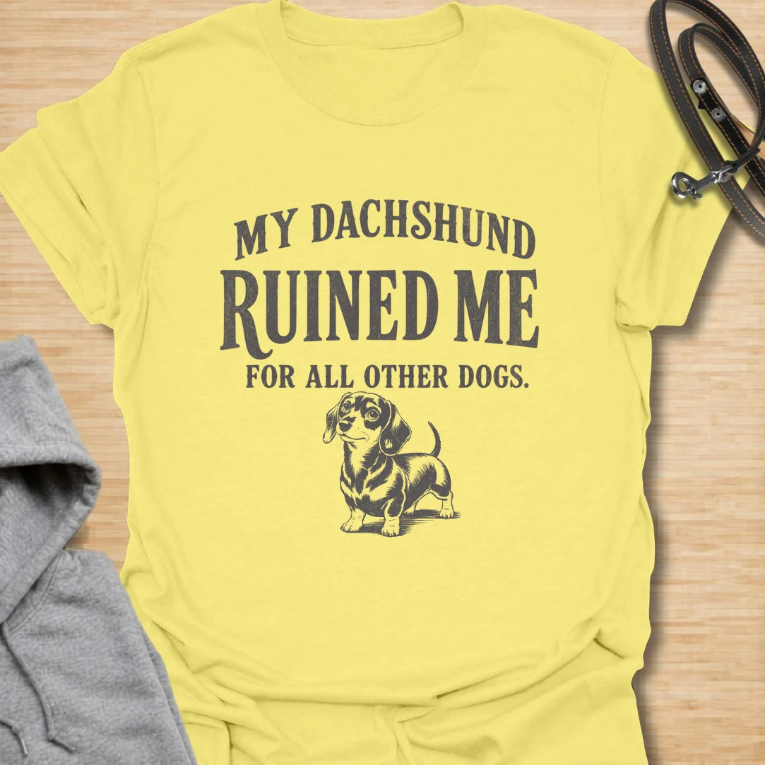 This My Dachshund Ruined Me For All Other Dogs t-shirt is made for doxie lovers who know once you love a dachshund, no other dog quite compares. Featuring bold vintage-style typography and a cute dachshund illustration, this design has a funny, loyal dog-parent feel that wiener dog fans will instantly understand. Perfect for dachshund moms, dachshund dads, doxie owners, rescue dog lovers, and anyone completely devoted to their little long dog.