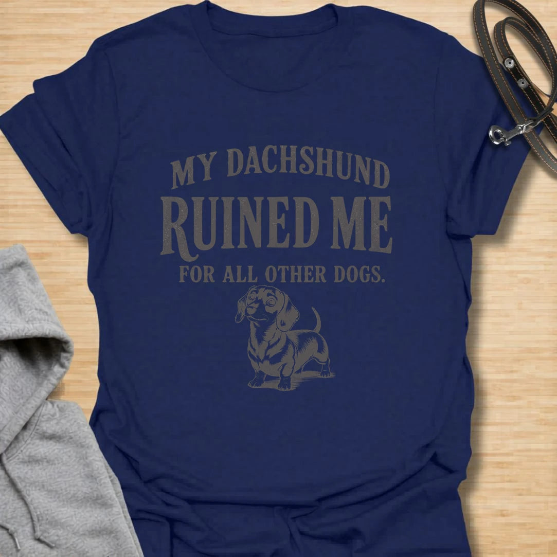This My Dachshund Ruined Me For All Other Dogs t-shirt is made for doxie lovers who know once you love a dachshund, no other dog quite compares. Featuring bold vintage-style typography and a cute dachshund illustration, this design has a funny, loyal dog-parent feel that wiener dog fans will instantly understand. Perfect for dachshund moms, dachshund dads, doxie owners, rescue dog lovers, and anyone completely devoted to their little long dog.