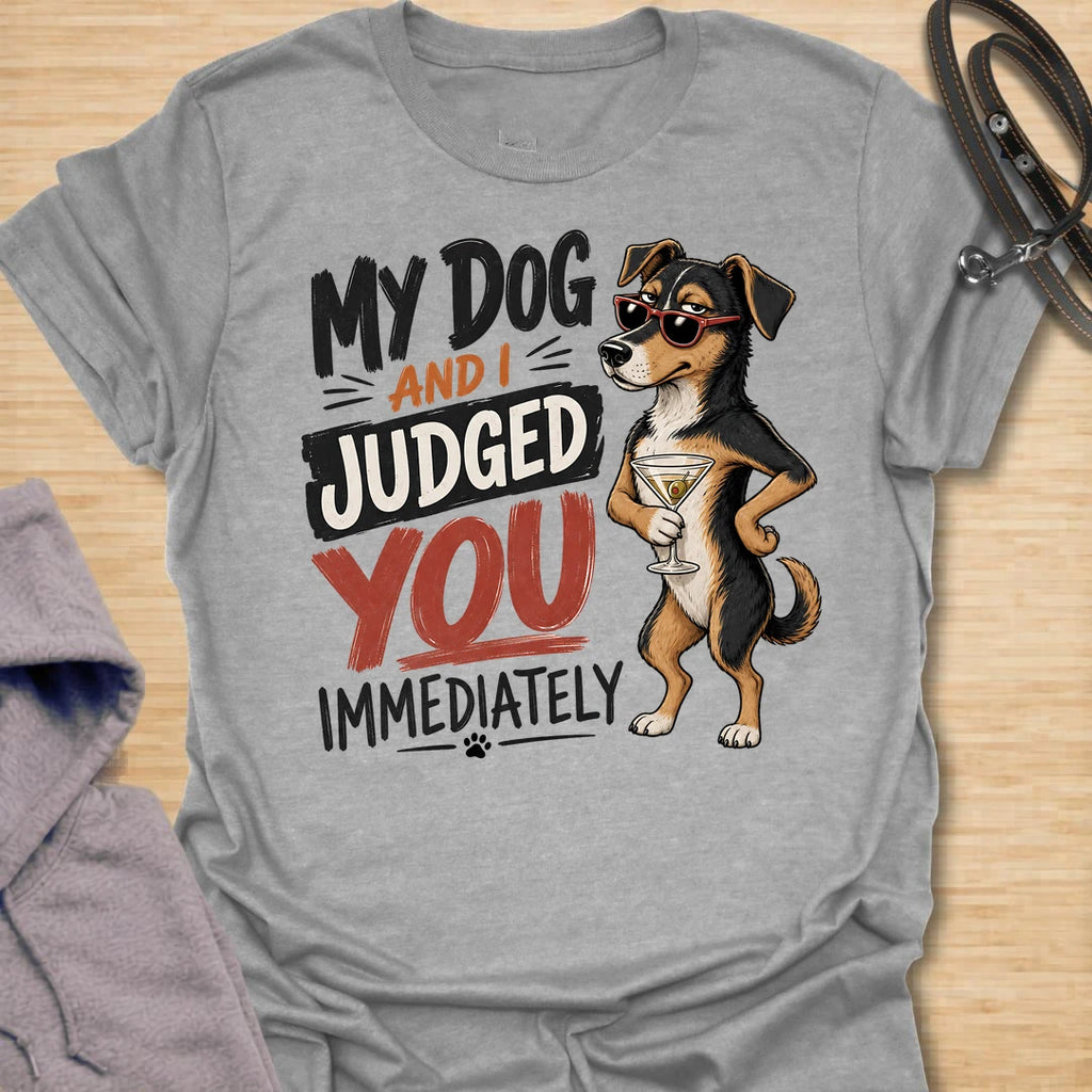 This My Dog And I Judged You Immediately t-shirt is made for dog lovers with a sarcastic sense of humor and a pup who notices everything. Featuring a sassy dachshund in sunglasses holding a cocktail, with bold retro lettering and attitude-packed styling, this design has a funny, confident dog-parent vibe. Perfect for dachshund moms, dachshund dads, dog lovers, rescue dog owners, pet parents, and anyone whose dog is just as judgmental as they are. Sport Grey