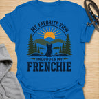 This My Favorite View Includes My Frenchie t-shirt is made for French Bulldog lovers who know every beautiful view is better with their little dog beside them. Featuring a scenic outdoor badge with mountains, pine trees, a sunset, and a seated Frenchie silhouette, this design has a warm adventure-inspired feel with breed-specific charm. Perfect for Frenchie moms, Frenchie dads, French Bulldog owners, outdoor dog lovers, hikers, campers, and anyone whose favorite view always includes their dog.