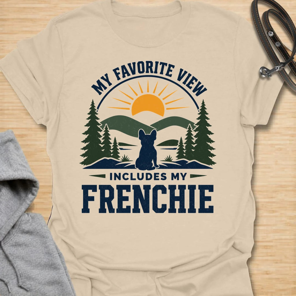 This My Favorite View Includes My Frenchie t-shirt is made for French Bulldog lovers who know every beautiful view is better with their little dog beside them. Featuring a scenic outdoor badge with mountains, pine trees, a sunset, and a seated Frenchie silhouette, this design has a warm adventure-inspired feel with breed-specific charm. Perfect for Frenchie moms, Frenchie dads, French Bulldog owners, outdoor dog lovers, hikers, campers, and anyone whose favorite view always includes their dog.