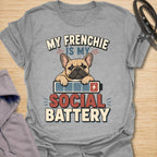 This My Frenchie Is My Social Battery t-shirt is made for French Bulldog lovers who know their little dog is the only social support they need. Featuring a tired Frenchie resting on a battery graphic with bold retro lettering, this design has a funny, relatable feel for introverted dog parents and Frenchie fans. Perfect for Frenchie moms, Frenchie dads, French Bulldog owners, rescue dog lovers, and anyone whose social battery is powered by their dog.