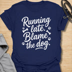 Funny dog lover t-shirt featuring the phrase “Running late. Blame the dog.” A perfect tee for dog moms, dog dads, rescue dog owners, and pet parents who know dogs always come first.