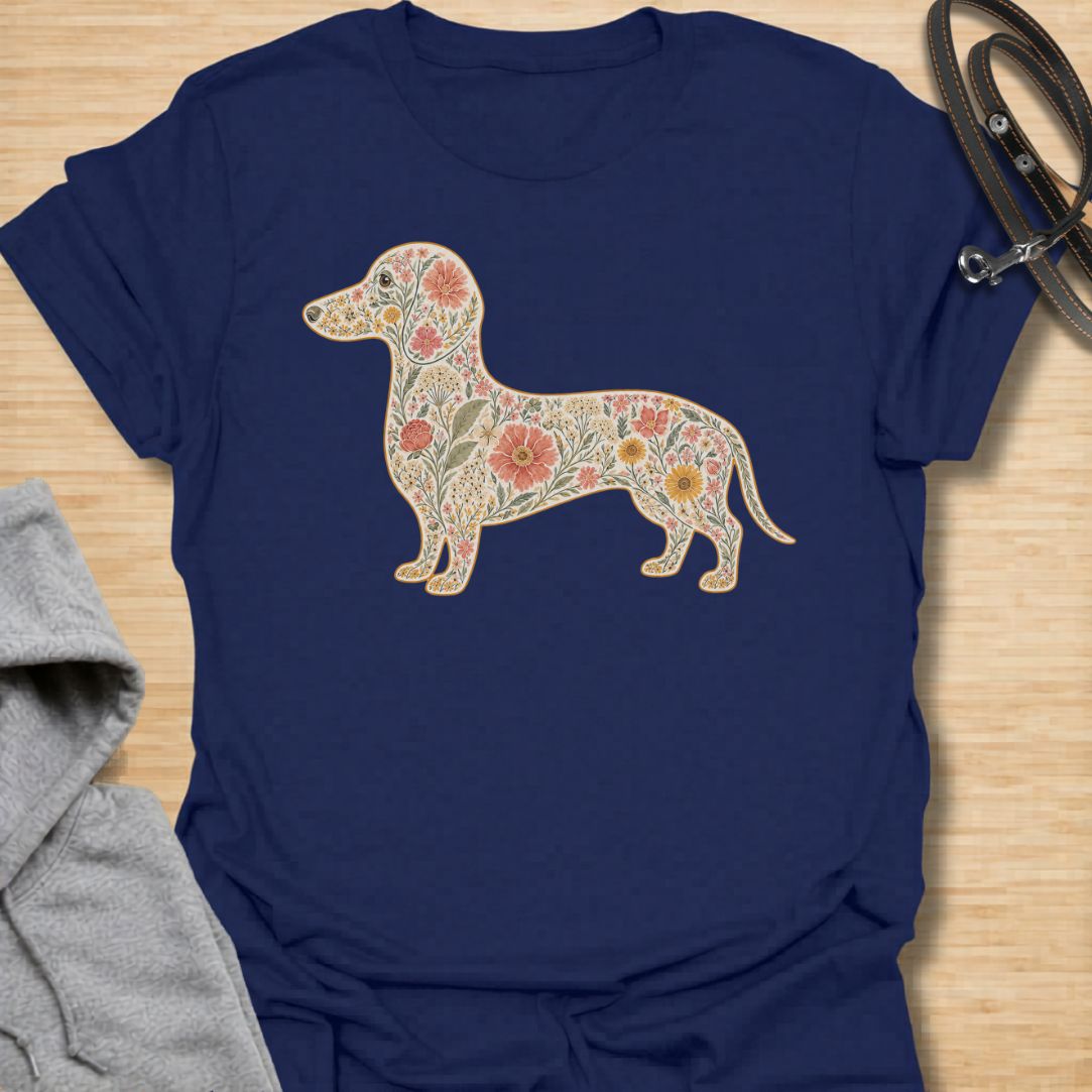 This Floral Dachshund t-shirt is made for doxie lovers who want a beautiful, botanical take on their favorite long dog. Featuring a dachshund silhouette filled with intricate flowers, leaves, vines, and vintage-style floral details, this design blends dog-lover charm with soft garden-inspired artwork. Perfect for dachshund moms, dachshund dads, wiener dog lovers, sausage dog fans, botanical art lovers, and anyone who loves both dogs and flowers.