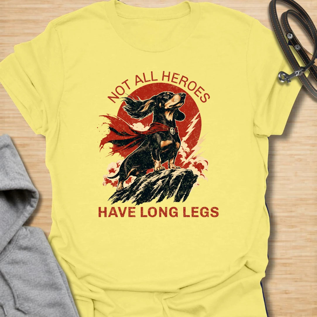 Not All Heroes Have Long Legs dachshund t-shirt for anyone who knows a sausage dog can still save the day. This bold comic-style design features a heroic dachshund with dramatic movement and strong vintage lettering. It is a fun gift for dachshund owners, doxie lovers, and wiener dog fans. Perfect for people who believe tiny legs can still carry a lot of personality.