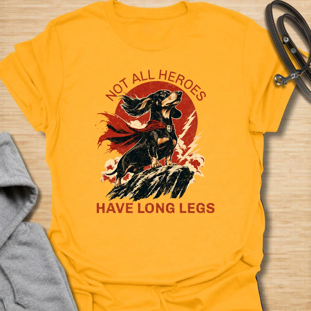 Not All Heroes Have Long Legs dachshund t-shirt for anyone who knows a sausage dog can still save the day. This bold comic-style design features a heroic dachshund with dramatic movement and strong vintage lettering. It is a fun gift for dachshund owners, doxie lovers, and wiener dog fans. Perfect for people who believe tiny legs can still carry a lot of personality.