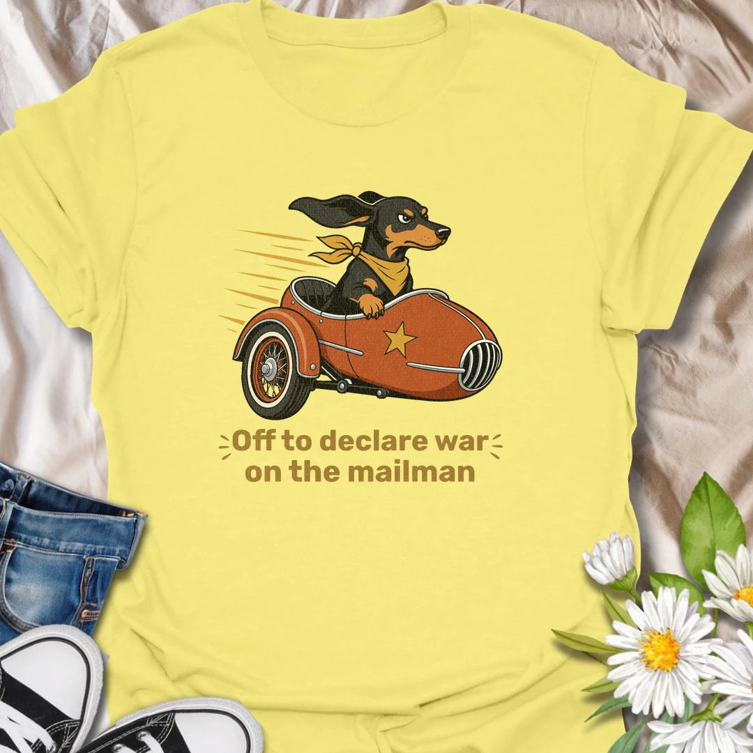 Your dachshund is off to defend the household from its most persistent visitor: the mailman. This funny T-shirt features a determined sausage dog heading into action in a vintage sidecar. A playful gift for dachshund owners familiar with daily barking, window patrol, and dramatic home security.