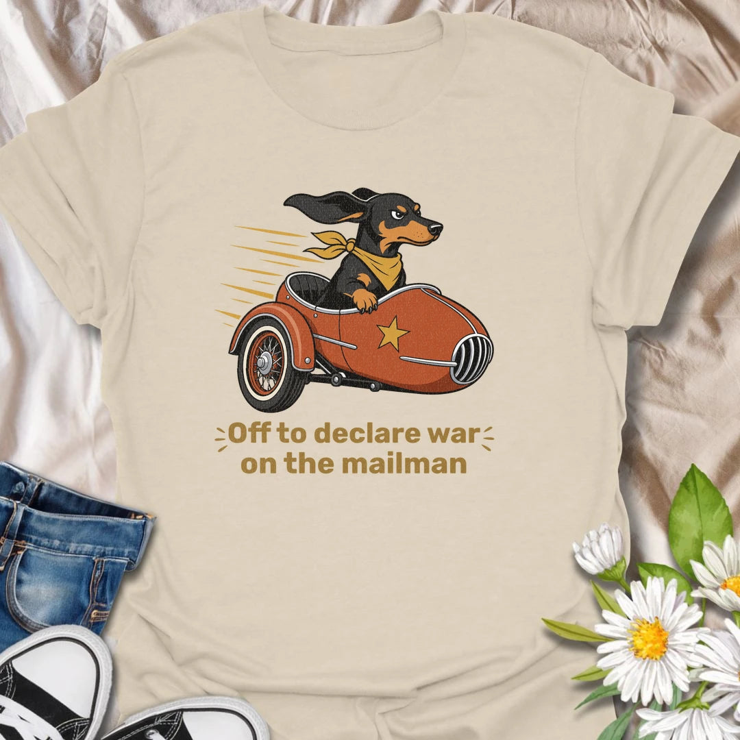 Your dachshund is off to defend the household from its most persistent visitor: the mailman. This funny T-shirt features a determined sausage dog heading into action in a vintage sidecar. A playful gift for dachshund owners familiar with daily barking, window patrol, and dramatic home security.