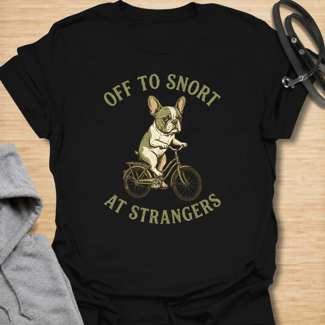 This Off To Snort At Strangers t-shirt is made for French Bulldog lovers who know their little dog has strong opinions and zero subtlety. Featuring a Frenchie riding a bicycle with a serious expression, this design has a funny breed-specific feel full of charm and attitude. Perfect for Frenchie moms, Frenchie dads, French Bulldog owners, rescue dog lovers, and anyone whose Frenchie greets strangers with snorts first.