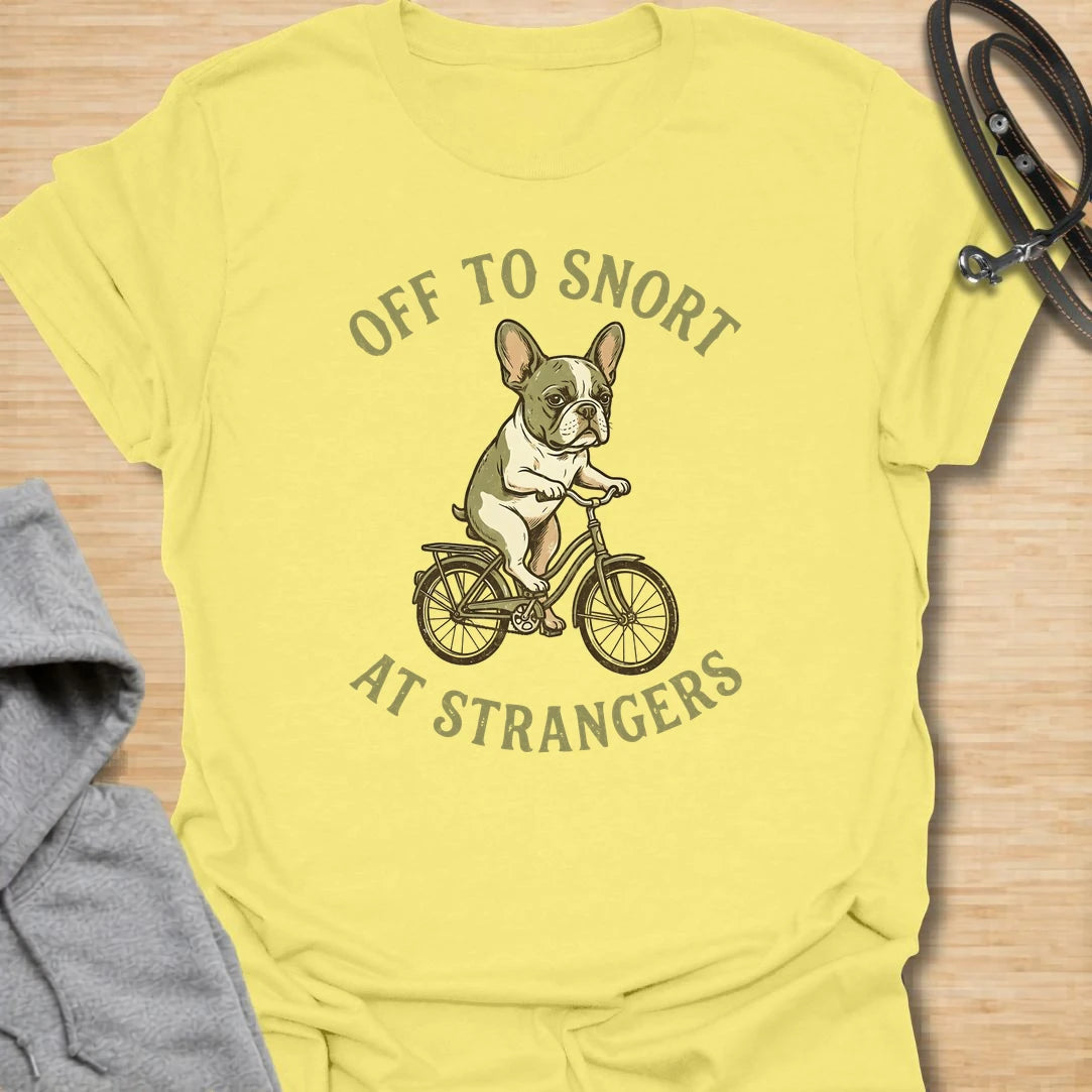 This Off To Snort At Strangers t-shirt is made for French Bulldog lovers who know their little dog has strong opinions and zero subtlety. Featuring a Frenchie riding a bicycle with a serious expression, this design has a funny breed-specific feel full of charm and attitude. Perfect for Frenchie moms, Frenchie dads, French Bulldog owners, rescue dog lovers, and anyone whose Frenchie greets strangers with snorts first.