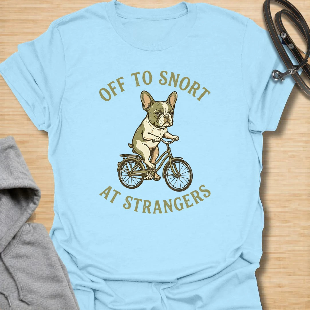 This Off To Snort At Strangers t-shirt is made for French Bulldog lovers who know their little dog has strong opinions and zero subtlety. Featuring a Frenchie riding a bicycle with a serious expression, this design has a funny breed-specific feel full of charm and attitude. Perfect for Frenchie moms, Frenchie dads, French Bulldog owners, rescue dog lovers, and anyone whose Frenchie greets strangers with snorts first.