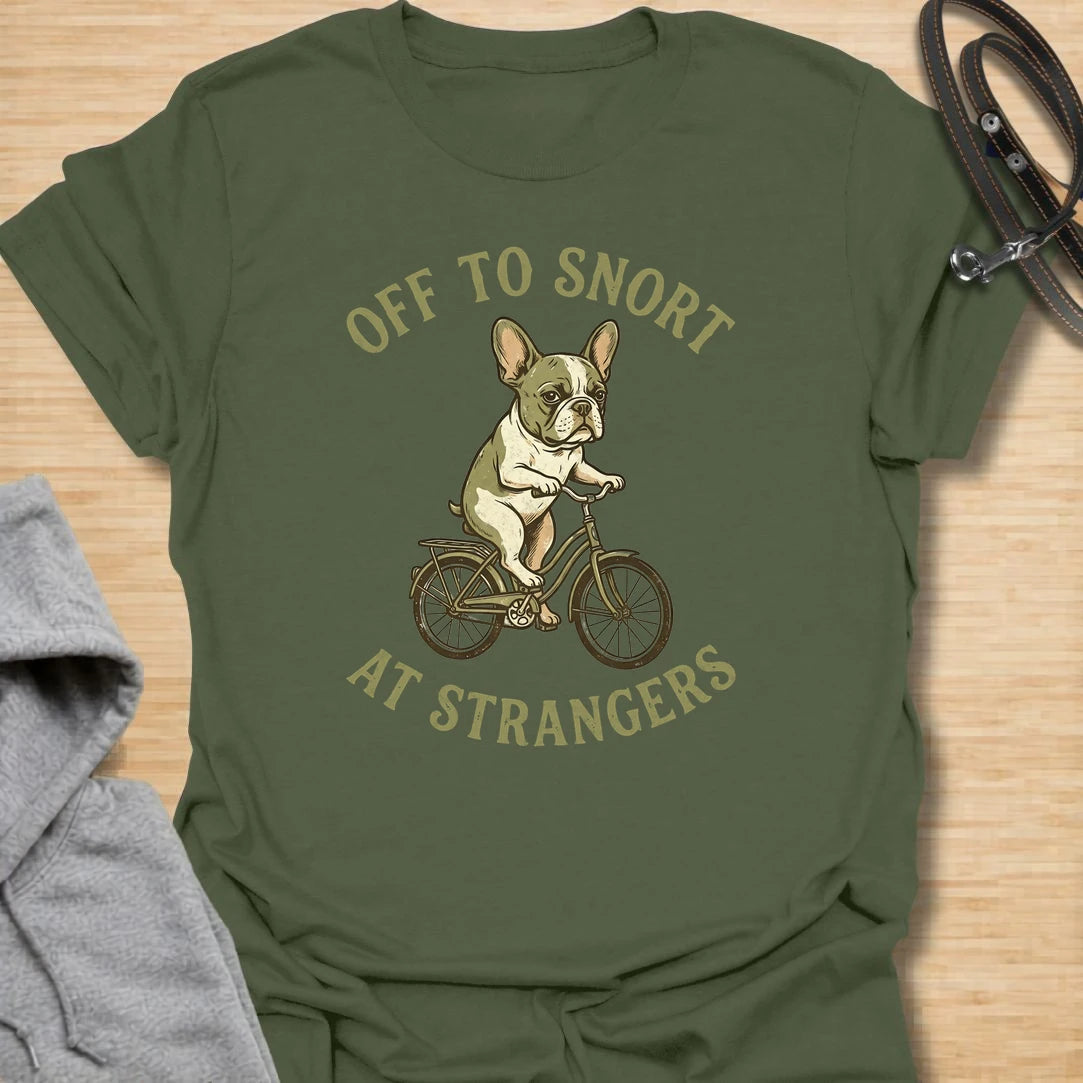 This Off To Snort At Strangers t-shirt is made for French Bulldog lovers who know their little dog has strong opinions and zero subtlety. Featuring a Frenchie riding a bicycle with a serious expression, this design has a funny breed-specific feel full of charm and attitude. Perfect for Frenchie moms, Frenchie dads, French Bulldog owners, rescue dog lovers, and anyone whose Frenchie greets strangers with snorts first.