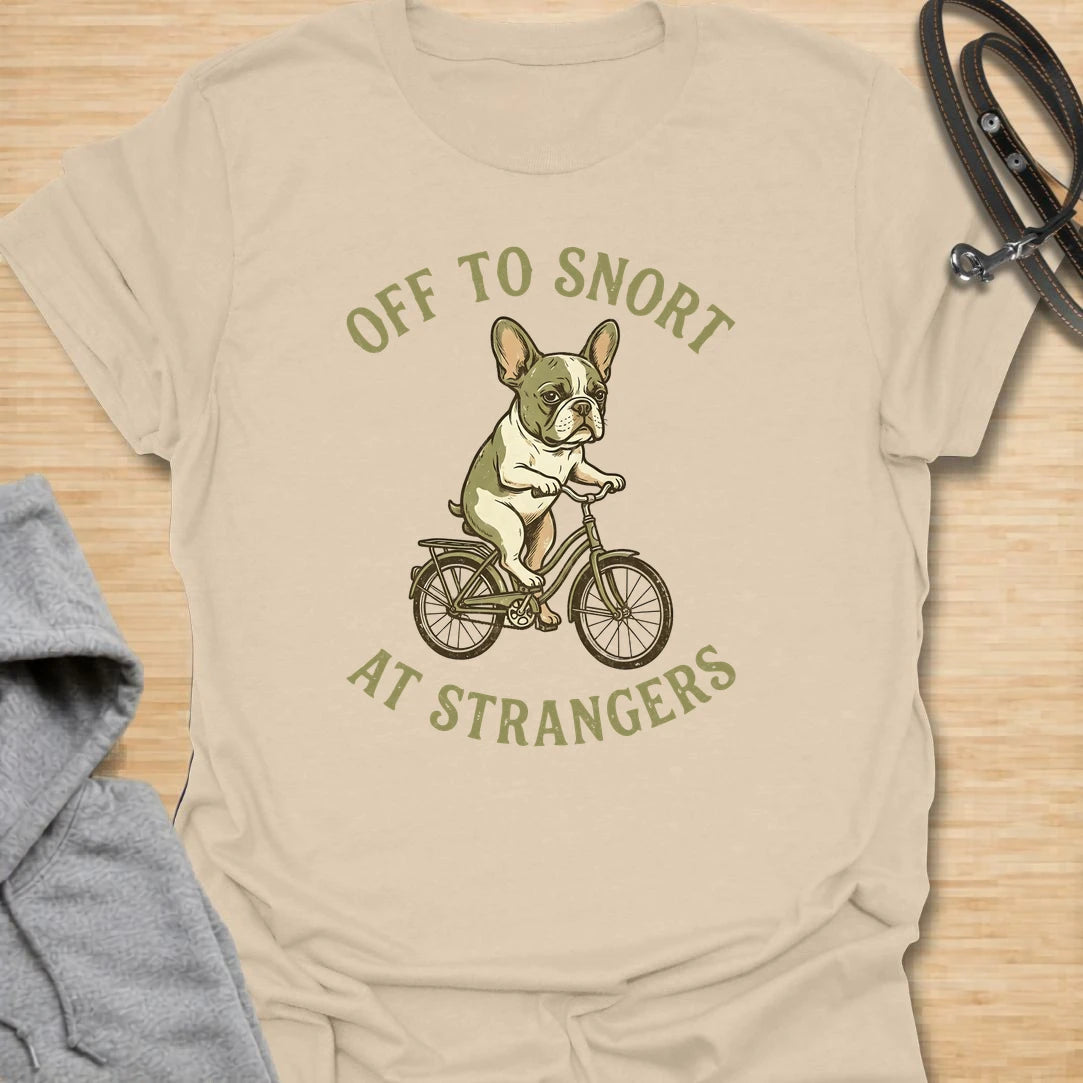 This Off To Snort At Strangers t-shirt is made for French Bulldog lovers who know their little dog has strong opinions and zero subtlety. Featuring a Frenchie riding a bicycle with a serious expression, this design has a funny breed-specific feel full of charm and attitude. Perfect for Frenchie moms, Frenchie dads, French Bulldog owners, rescue dog lovers, and anyone whose Frenchie greets strangers with snorts first.