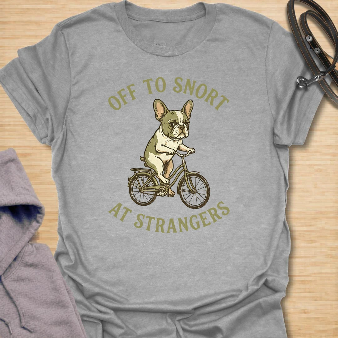 This Off To Snort At Strangers t-shirt is made for French Bulldog lovers who know their little dog has strong opinions and zero subtlety. Featuring a Frenchie riding a bicycle with a serious expression, this design has a funny breed-specific feel full of charm and attitude. Perfect for Frenchie moms, Frenchie dads, French Bulldog owners, rescue dog lovers, and anyone whose Frenchie greets strangers with snorts first.