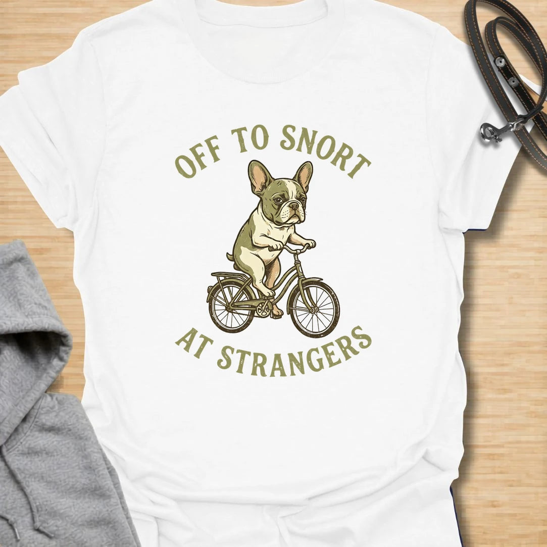This Off To Snort At Strangers t-shirt is made for French Bulldog lovers who know their little dog has strong opinions and zero subtlety. Featuring a Frenchie riding a bicycle with a serious expression, this design has a funny breed-specific feel full of charm and attitude. Perfect for Frenchie moms, Frenchie dads, French Bulldog owners, rescue dog lovers, and anyone whose Frenchie greets strangers with snorts first.