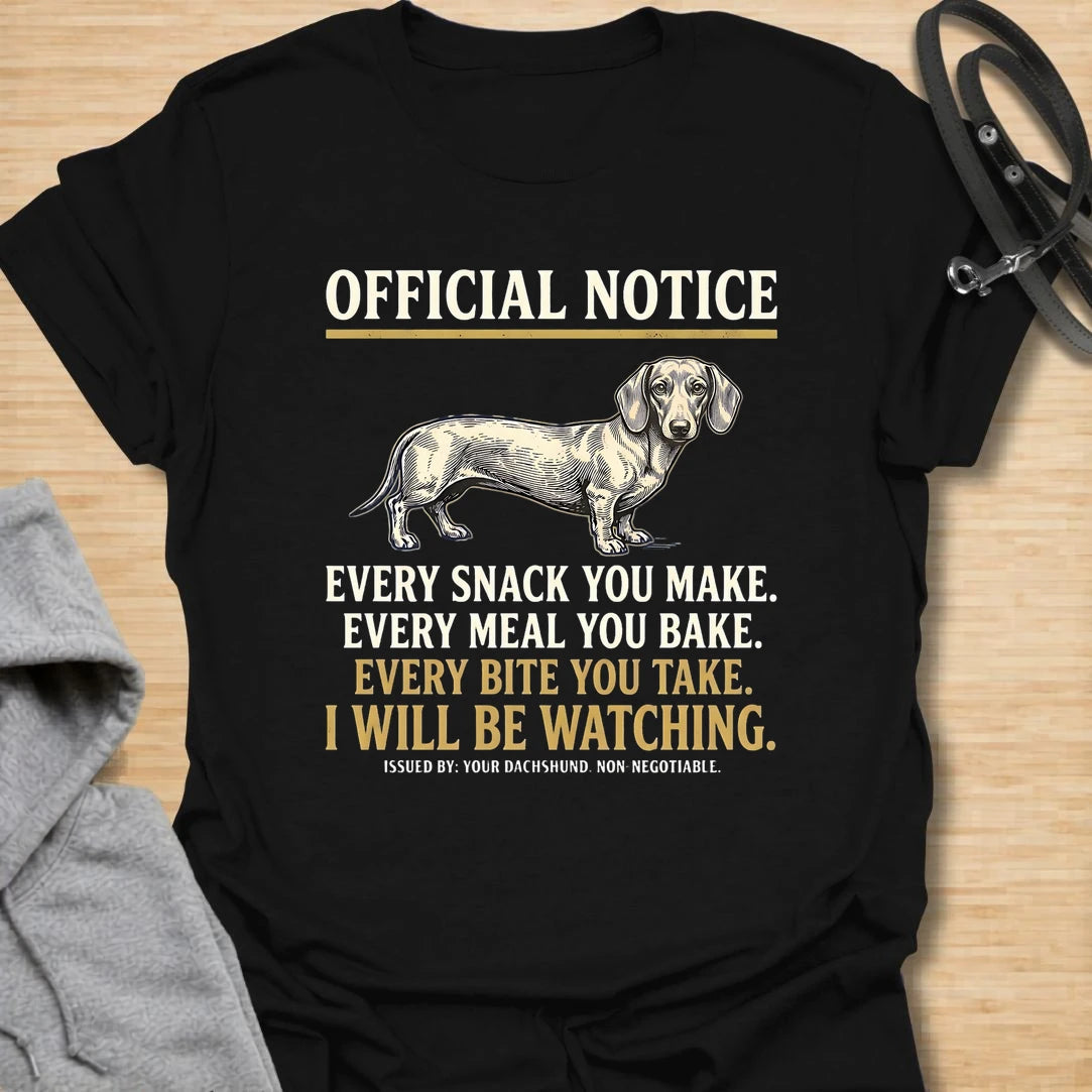 This Official Notice dachshund t-shirt is made for doxie lovers who know their little long dog is always watching when food is involved. Featuring a vintage-style dachshund illustration with bold notice-style typography and the funny phrase Every Snack You Make, Every Meal You Bake, Every Bite You Take, I Will Be Watching, this design has a playful dog-parent feel that wiener dog fans will instantly understand. Perfect for dachshund moms, dachshund dads, snack-sharing dog owners, rescue dog lovers, and anyo