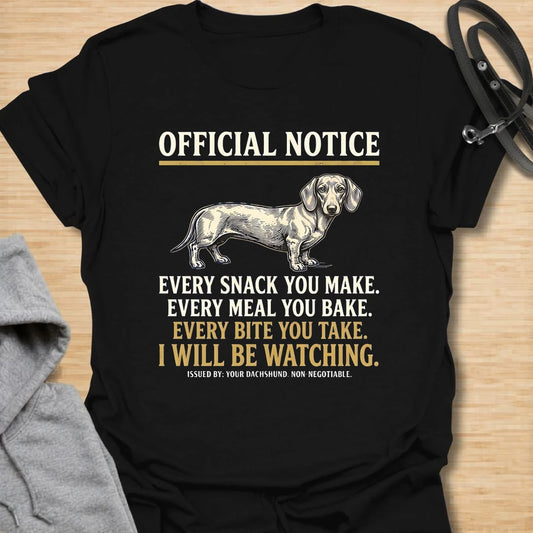 This Official Notice dachshund t-shirt is made for doxie lovers who know their little long dog is always watching when food is involved. Featuring a vintage-style dachshund illustration with bold notice-style typography and the funny phrase Every Snack You Make, Every Meal You Bake, Every Bite You Take, I Will Be Watching, this design has a playful dog-parent feel that wiener dog fans will instantly understand. Perfect for dachshund moms, dachshund dads, snack-sharing dog owners, rescue dog lovers, and anyo
