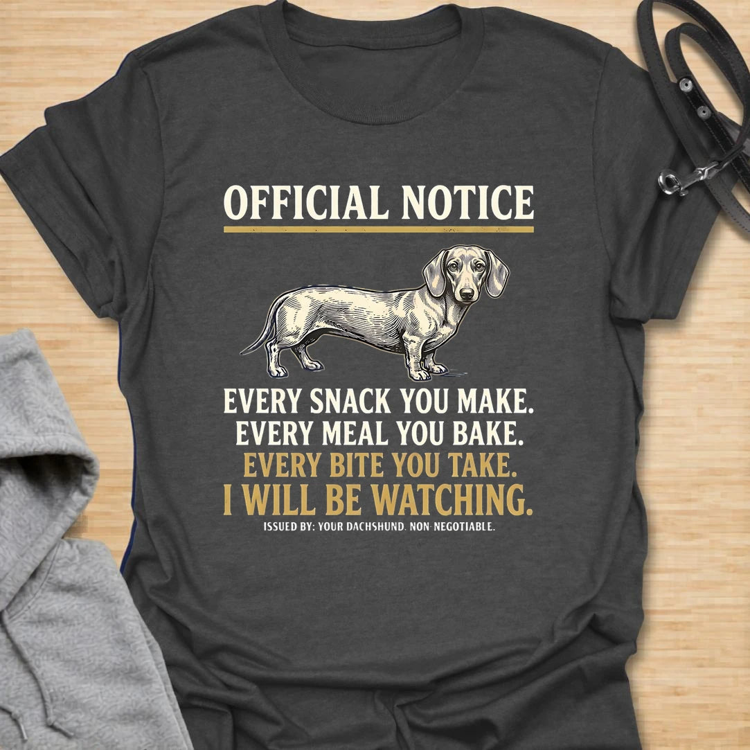 This Official Notice dachshund t-shirt is made for doxie lovers who know their little long dog is always watching when food is involved. Featuring a vintage-style dachshund illustration with bold notice-style typography and the funny phrase Every Snack You Make, Every Meal You Bake, Every Bite You Take, I Will Be Watching, this design has a playful dog-parent feel that wiener dog fans will instantly understand. Perfect for dachshund moms, dachshund dads, snack-sharing dog owners, rescue dog lovers, and anyo