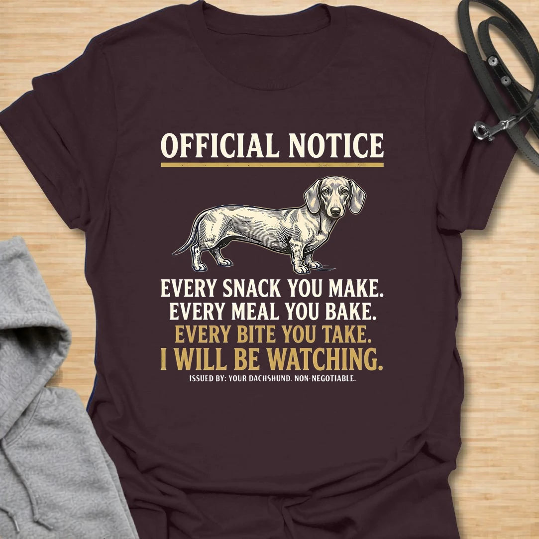 This Official Notice dachshund t-shirt is made for doxie lovers who know their little long dog is always watching when food is involved. Featuring a vintage-style dachshund illustration with bold notice-style typography and the funny phrase Every Snack You Make, Every Meal You Bake, Every Bite You Take, I Will Be Watching, this design has a playful dog-parent feel that wiener dog fans will instantly understand. Perfect for dachshund moms, dachshund dads, snack-sharing dog owners, rescue dog lovers, and anyo