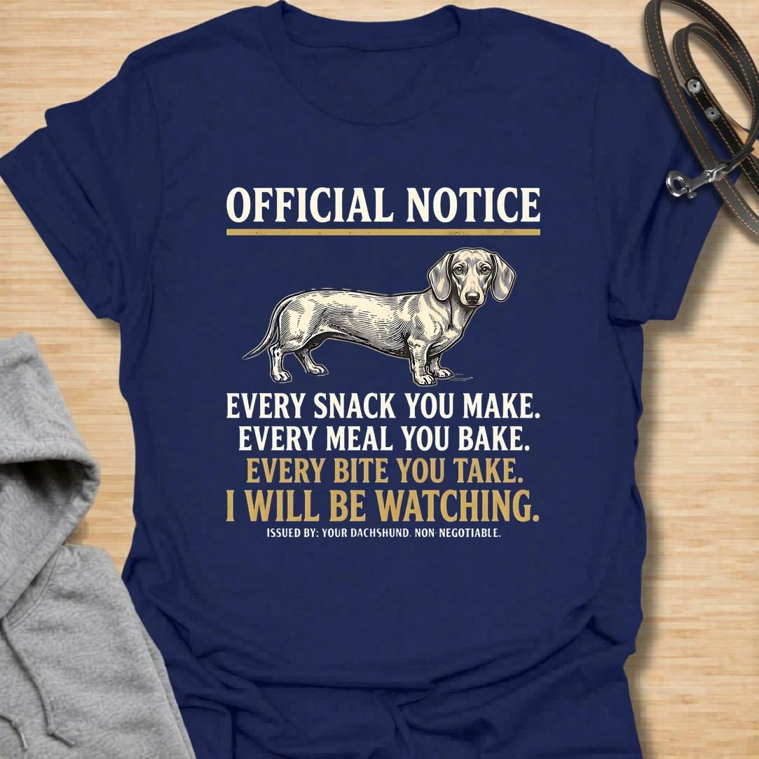 This Official Notice dachshund t-shirt is made for doxie lovers who know their little long dog is always watching when food is involved. Featuring a vintage-style dachshund illustration with bold notice-style typography and the funny phrase Every Snack You Make, Every Meal You Bake, Every Bite You Take, I Will Be Watching, this design has a playful dog-parent feel that wiener dog fans will instantly understand. Perfect for dachshund moms, dachshund dads, snack-sharing dog owners, rescue dog lovers, and anyo