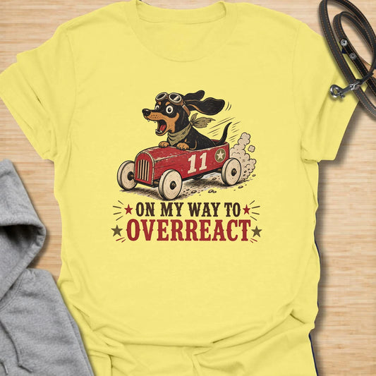 On My Way to Overreact t-shirt for dachshund lovers who know their little dog brings maximum drama to every situation. This funny vintage design features a chaotic wiener dog speeding along in a red racer car with bold retro lettering and classic doxie personality. Perfect for dachshund moms, doxie dads, sausage dog owners, and anyone who loves dramatic little dogs with big opinions.