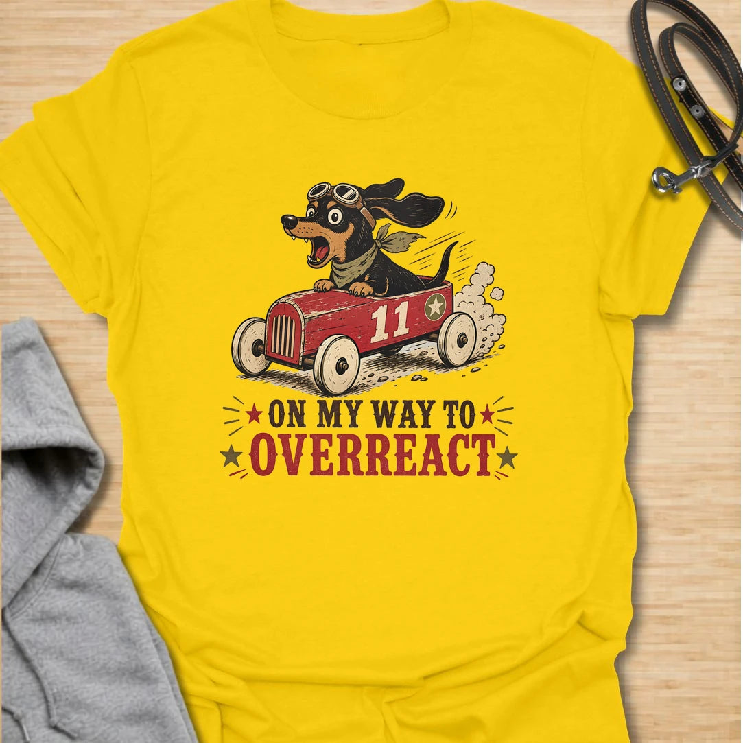 On My Way to Overreact t-shirt for dachshund lovers who know their little dog brings maximum drama to every situation. This funny vintage design features a chaotic wiener dog speeding along in a red racer car with bold retro lettering and classic doxie personality. Perfect for dachshund moms, doxie dads, sausage dog owners, and anyone who loves dramatic little dogs with big opinions.