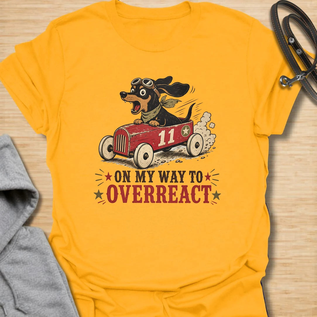 On My Way to Overreact t-shirt for dachshund lovers who know their little dog brings maximum drama to every situation. This funny vintage design features a chaotic wiener dog speeding along in a red racer car with bold retro lettering and classic doxie personality. Perfect for dachshund moms, doxie dads, sausage dog owners, and anyone who loves dramatic little dogs with big opinions.