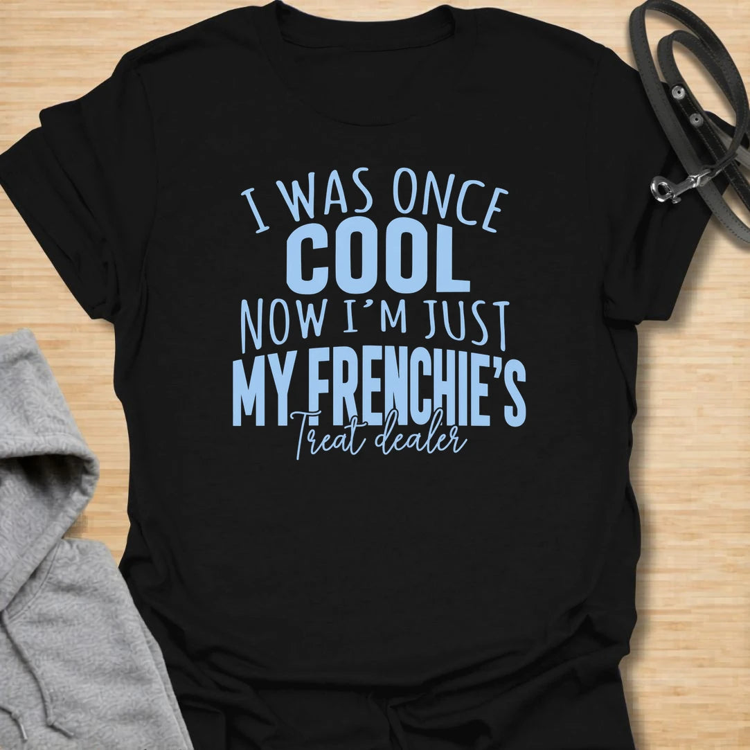 This I Was Once Cool Now I’m Just My Frenchie’s Treat Dealer t-shirt is made for French Bulldog lovers who know their little dog has completely taken over their priorities. Featuring bold mixed typography and a funny treat-dealer message, this design has a relatable dog-parent feel that Frenchie owners will instantly understand. Perfect for Frenchie moms, Frenchie dads, French Bulldog owners, rescue dog lovers, and anyone whose pockets are basically full of dog treats now.