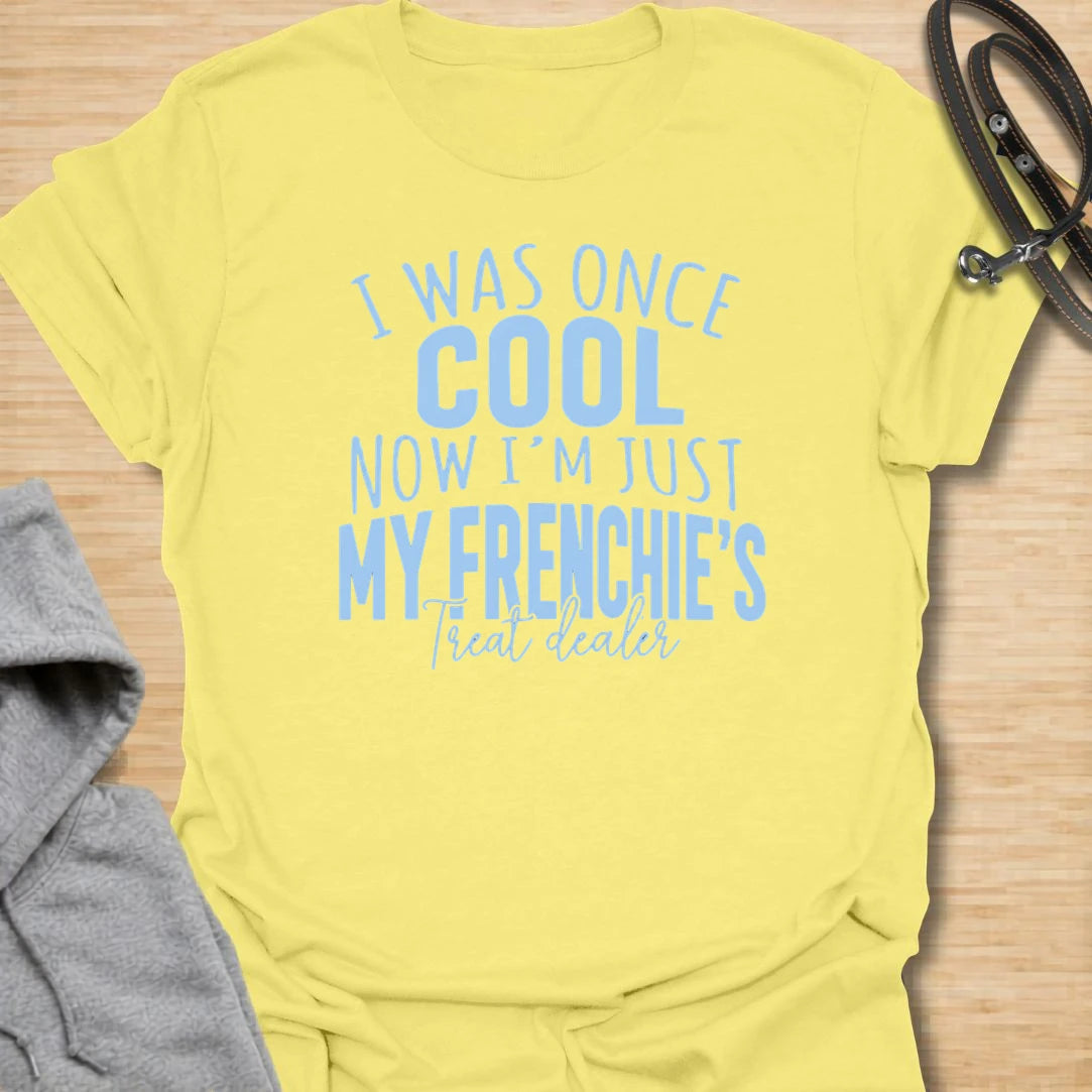 This I Was Once Cool Now I’m Just My Frenchie’s Treat Dealer t-shirt is made for French Bulldog lovers who know their little dog has completely taken over their priorities. Featuring bold mixed typography and a funny treat-dealer message, this design has a relatable dog-parent feel that Frenchie owners will instantly understand. Perfect for Frenchie moms, Frenchie dads, French Bulldog owners, rescue dog lovers, and anyone whose pockets are basically full of dog treats now.